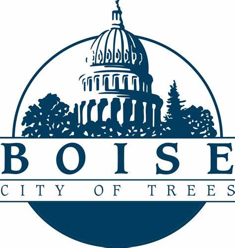 A graphic logo featuring the dome of a capitol building, trees, and the text "Boise City of Trees" in bold letters.
