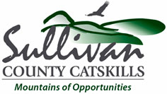 Sullivan County Catskills logo with a green mountain, a bird silhouette, and the slogan "Mountains of Opportunities" beneath the name.