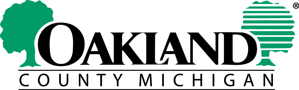 Oakland County Michigan logo with the word "Oakland" in large black text, flanked by two green tree graphics, and "County Michigan" in smaller text below.